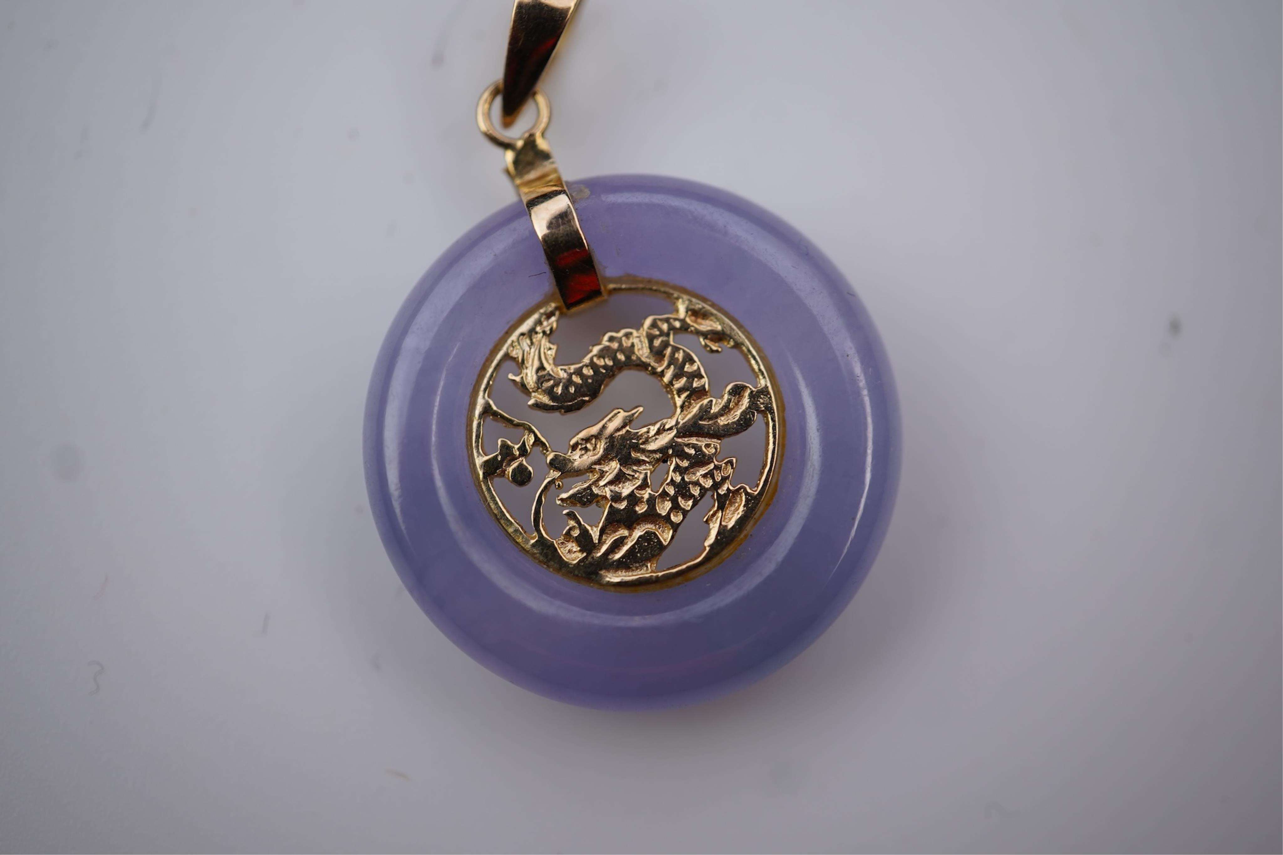 Two jadeite pendants
